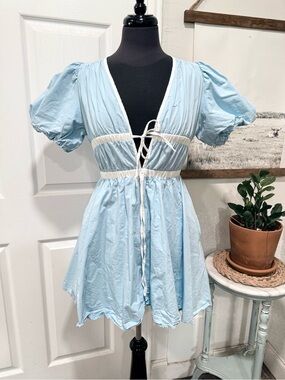 Light Blue Linen Puff Sleeve Babydoll Dress with Tie Front by Baby Pink.